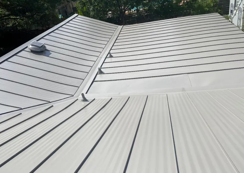 Solar attic fan installed on a metal roof for Roof Ventilation in Fort Myers Beach